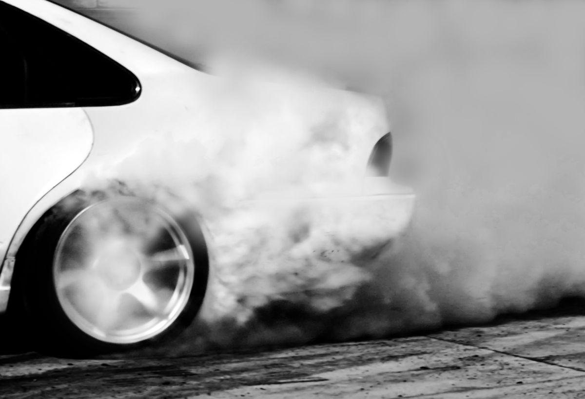Blurred of drift car, Car wheel drifting and smoking on track.